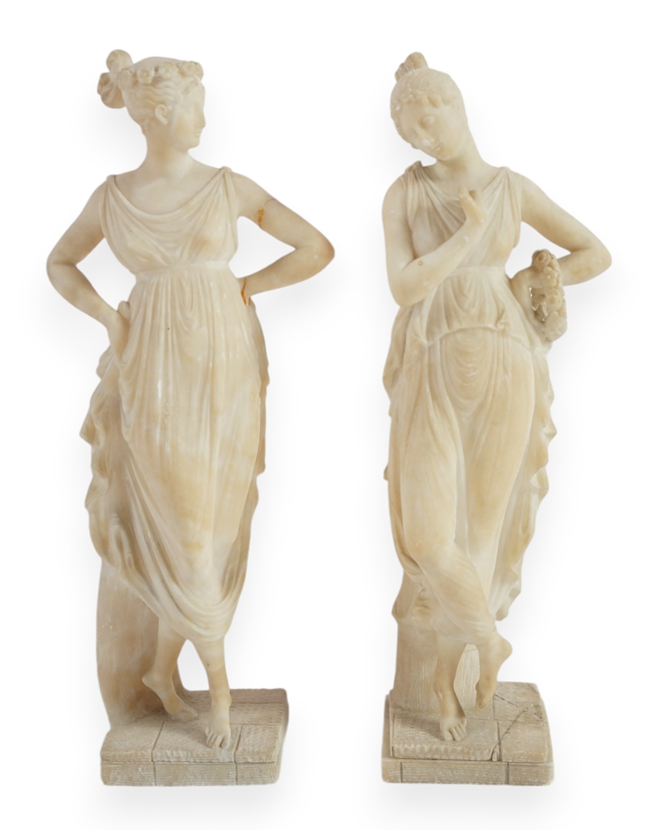 After the antique, a pair of 19th century Italian carved alabaster figures of muses